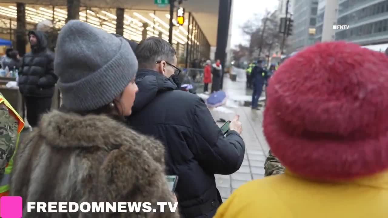 Oliya Scootercaster 🛴 - DC: Mateusz Morawiecki, former prime minister of Poland, stands outside DC Trump rally at Capital One Arena, attempting to convince National Guard of who he is by showing them his Wikipedia page.