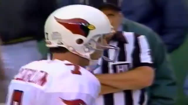 Minnesota Vikings quarterback Randall Cunningham waves to someone