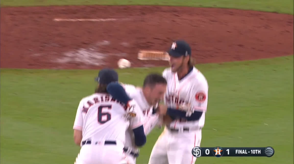 Alex Bregman catches the ball after it bounces off