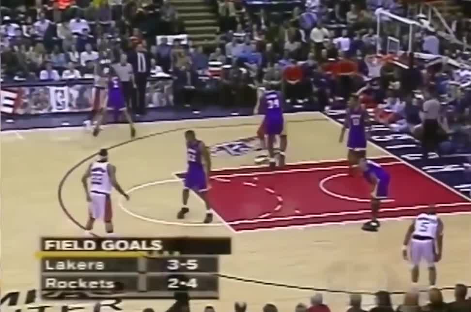 Yao Ming blocks Shaquille O'Neal's first three shots and scores Houston ...