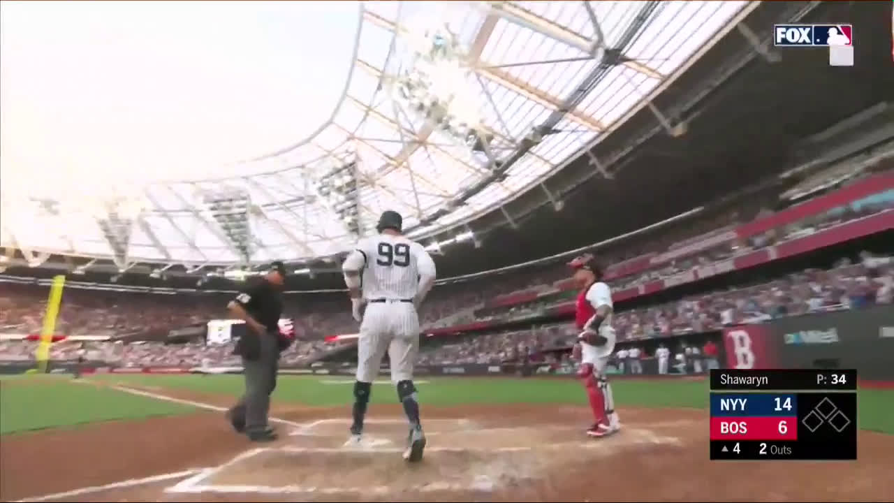 Fan wears Yankees and Red Sox hat in London