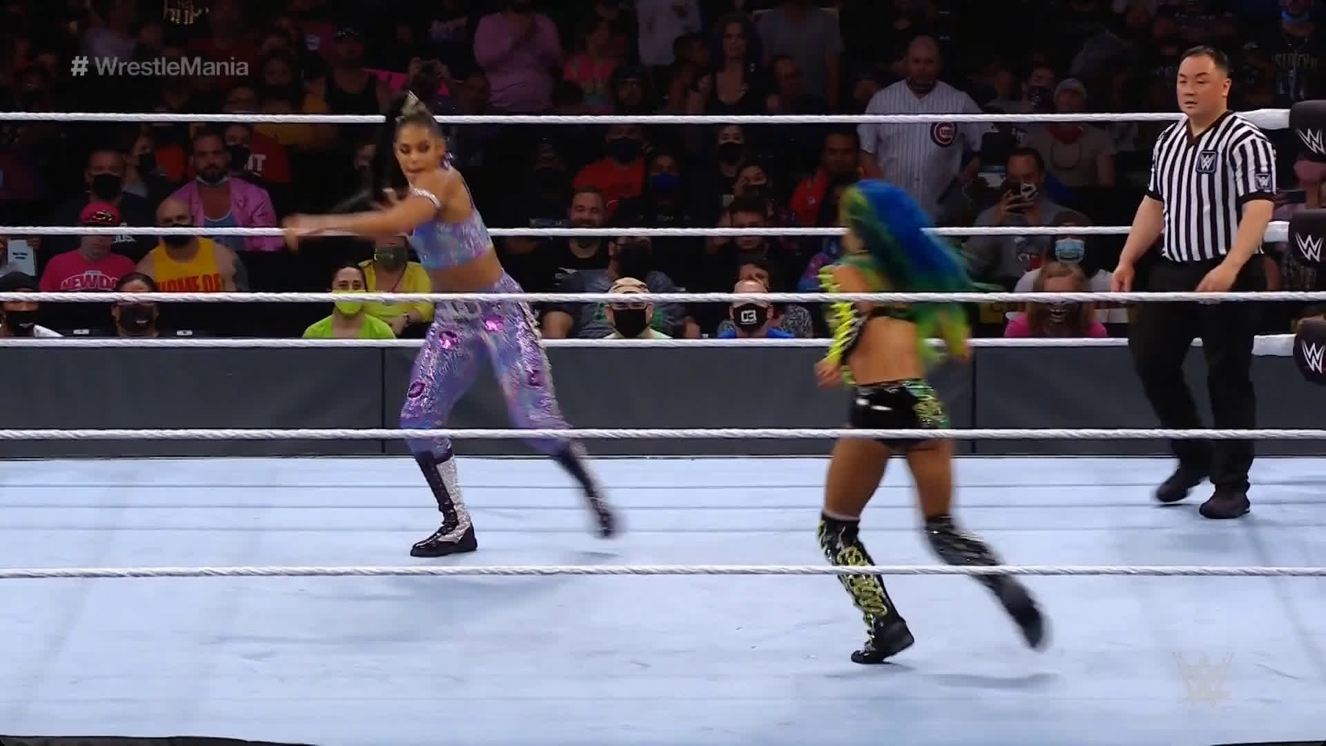 Bianca Belair hair whips Sasha Banks.