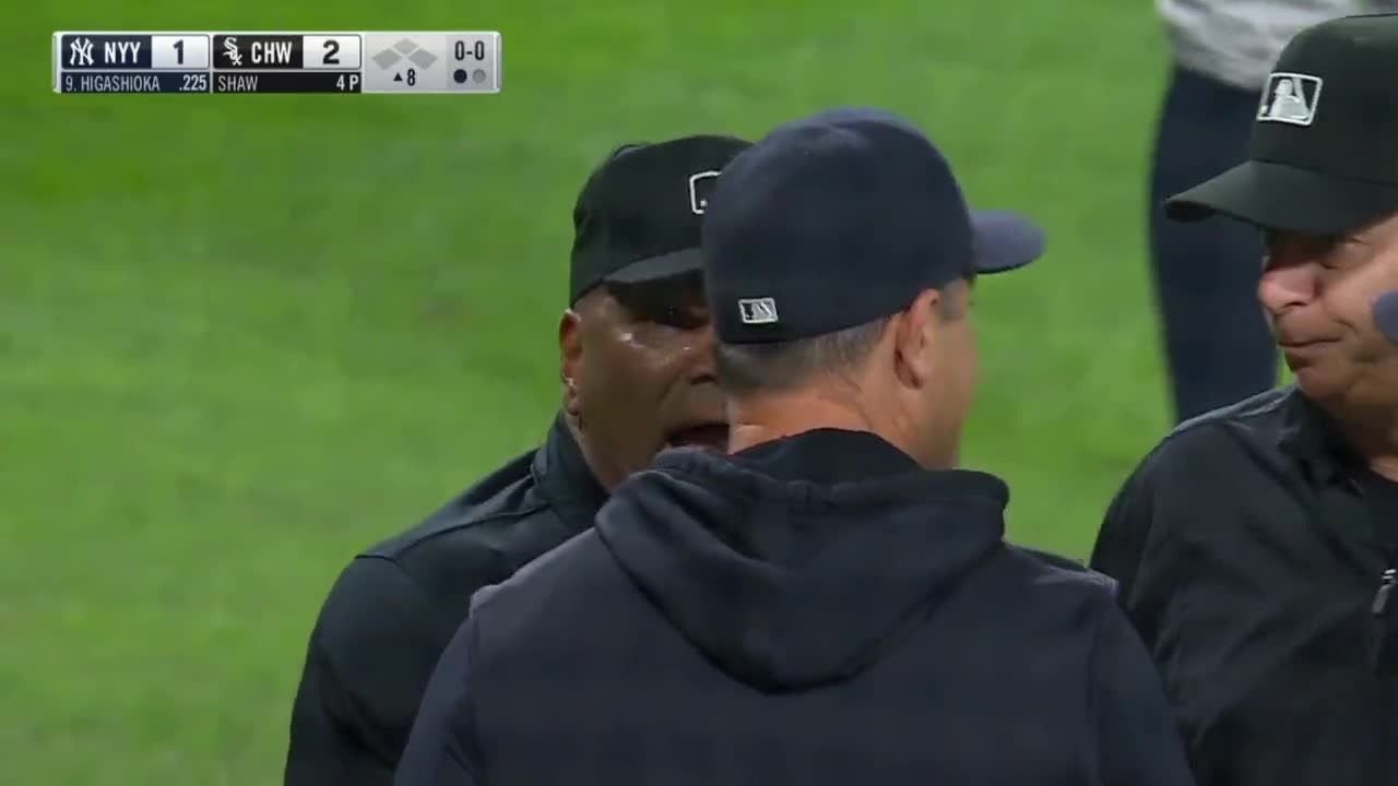 Yogi Berra arguing with umpire over his safe call in the 1st