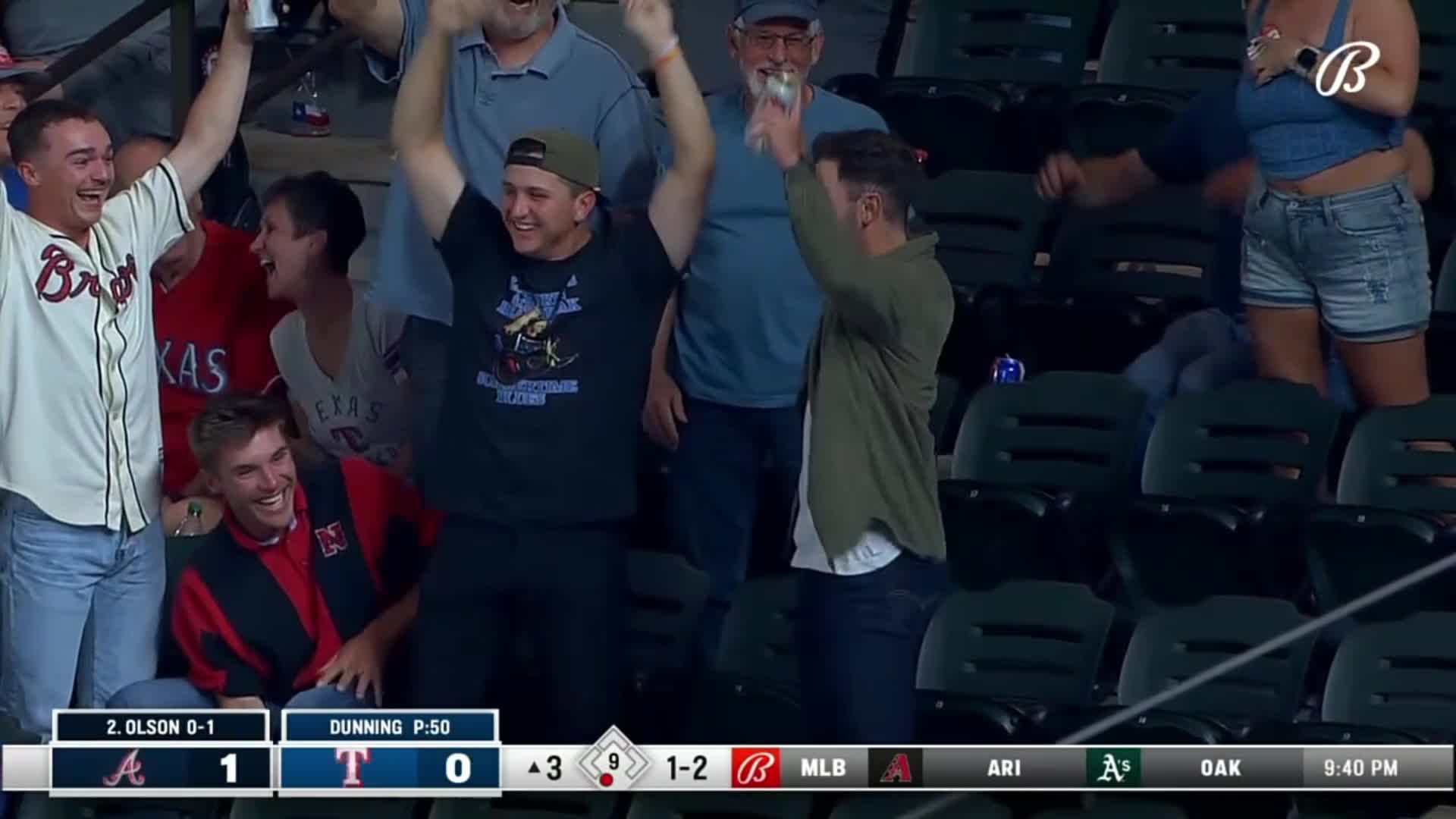 Fan makes a great one-handed catch of a hard-hit foul ball by Matt Olson.