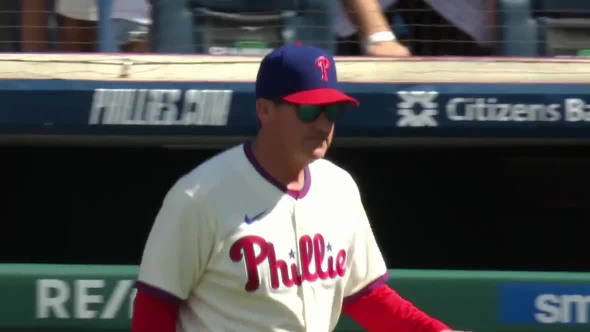 Philadelphia Phillies batter John Kruk throws his batting helmet