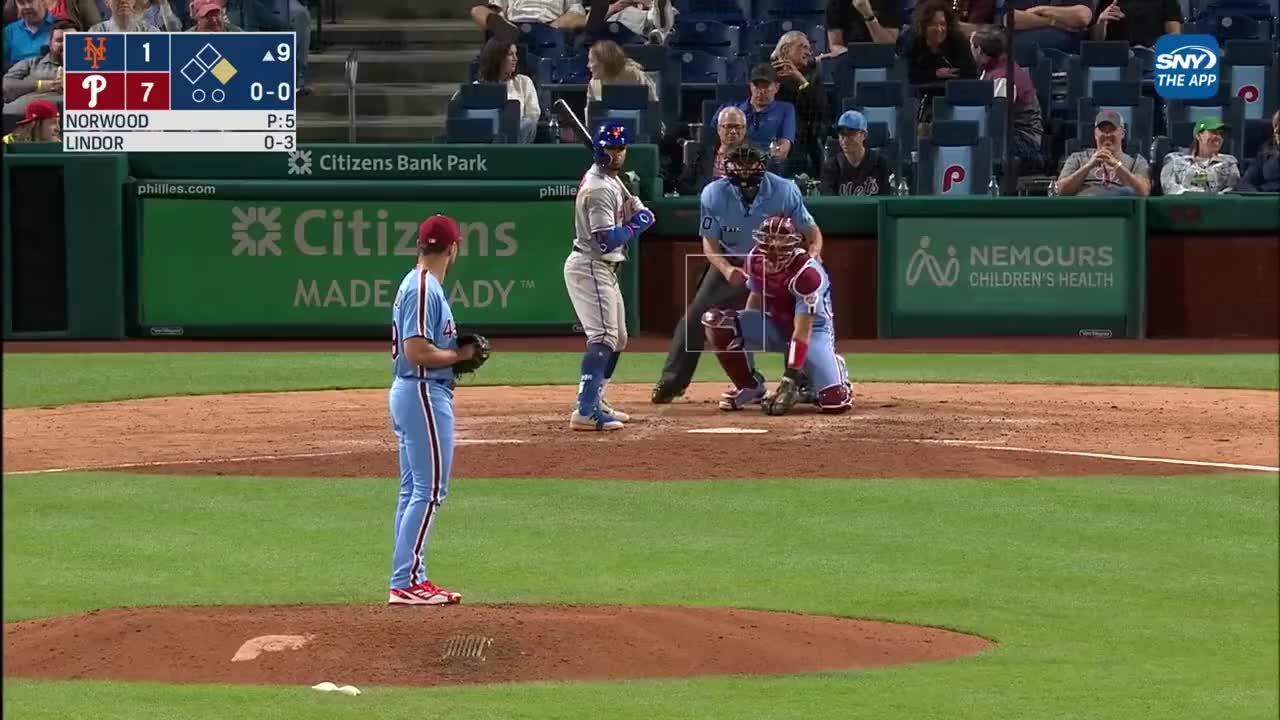 Philadelphia Phillies batter John Kruk throws his batting helmet after