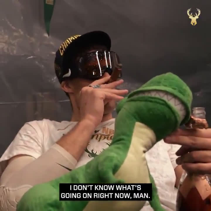 Brook Lopez smoking a cigar, drinking champagne and chilling with his  stuffed Dino : r/nba