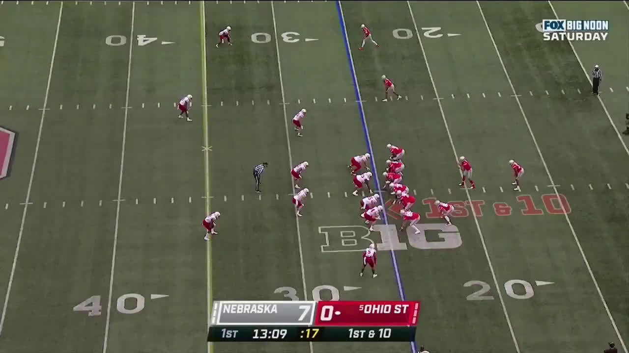 Download Ohio State quarterback Justin Fields delivers a pass