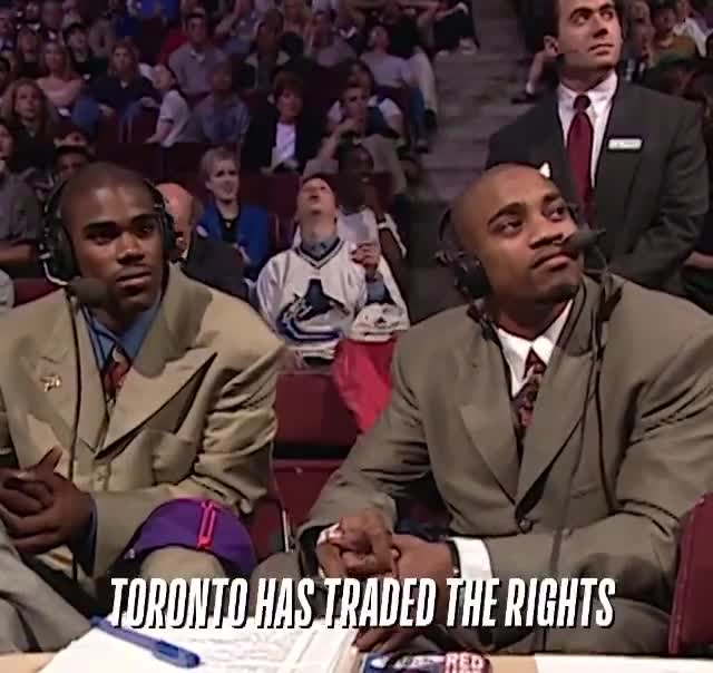 1998 draft night) Vince Carter and Antawn Jamison listen to the