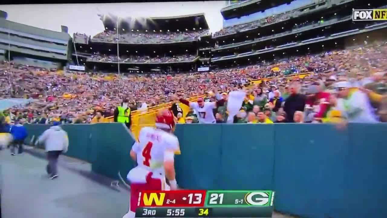 Lambeau Leap! Patrick Taylor celebrates after TD run