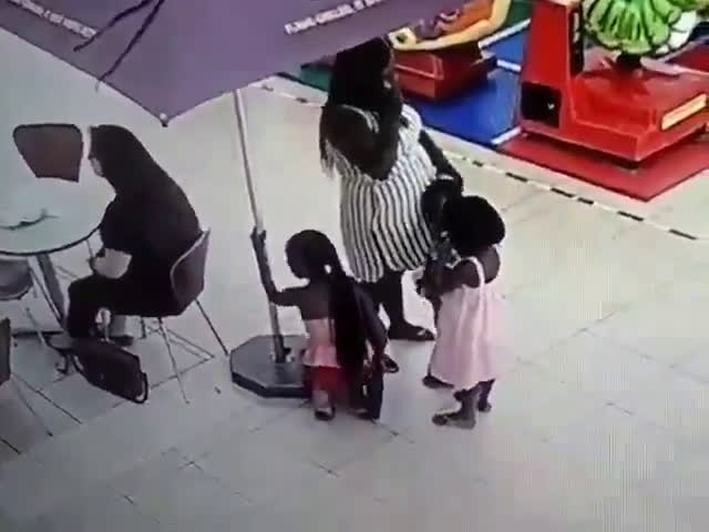 Mother teaching children to steal..
